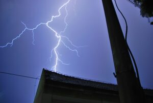 Lightning strike on house at night